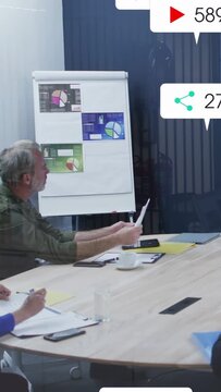 Vertical video: Mgr holding page, checking phone in biz for ads, phone pinging icons then fading