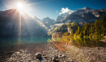 The most gorgeous Swiss lake Oeschinensee surrounded by grand mountains. Location Bernese Oberland, Switzerland, Europe.