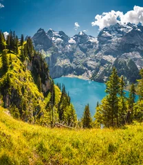 A serene turquoise Oeschinensee lake surrounded by majestic mountains. Bernese Oberland, Switzerland, Kandersteg, Europe. © Leonid Tit