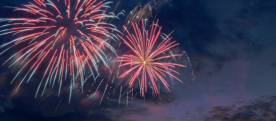 Festive night fireworks background with colors of American flag, suitable for USA Independence day, free space for text © syntheticmessiah