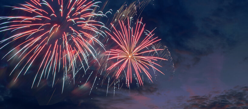 Festive fireworks background, night fireworks with colors of American flag, suitable for 4th of July USA Independence day, free space for text