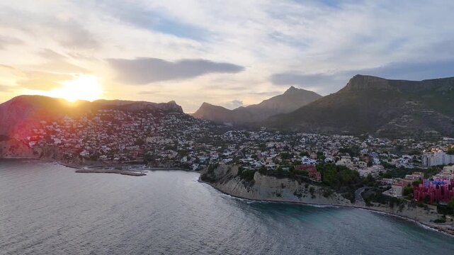 coast sunset mountain skyline sunlight chiaroscuro drone aerial nature urban city building housing coastline cliff border travel tourism - Calpe, Spain - 2025