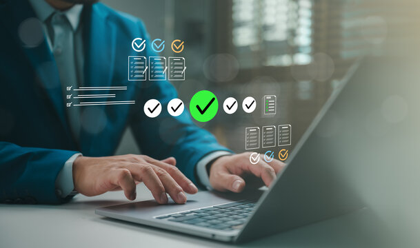 Business professional using laptop with digital approval checklist, green checkmark, document review icons, compliance workflow, task validation, quality control, productivity management interface.