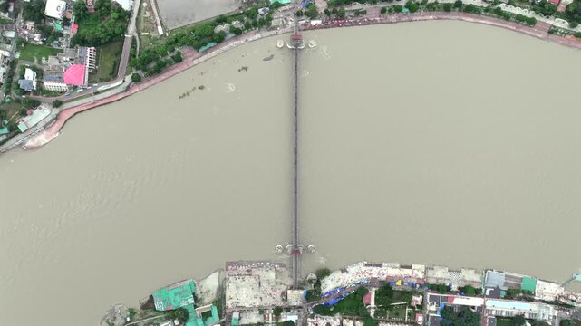 Aerial shot of Ram Jhula suspension bridge over Ganges River in Rishikesh India