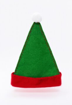 Green felt elf hat with red trim isolated on white background