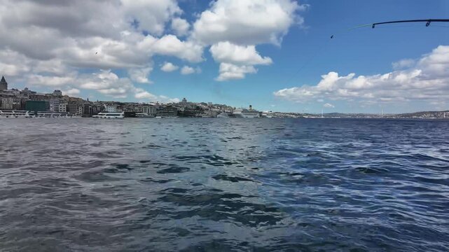 Breathtaking Timelapse of Istanbul's Golden Horn and Galata Tower with Ferries Passing Under Sunny Blue Sky, Scenic Bosphorus View with Fluffy White Clouds, Historical Istanbul Cityscape in Turkey