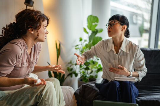 Woman expressing emotions during counseling session with therapist