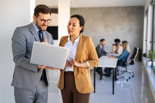 Portrait of successful multicultural business team working in corporate business office