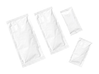 Fototapeta premium Overhead view of multiple blank white individual packets or sachets, ready for branding and content.