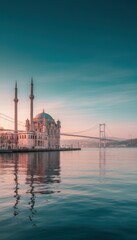 Naklejka premium Dramatic sunrise sky over a waterfront mosque and suspension bridge for travel editorial, architectural lifestyle features and cultural heritage storytelling themes