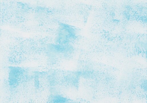 A watercolor background dabbed and smudged with light blue paint using a sponge