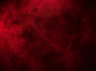 Intense deep red smoke swirling against a stark black background, creating an abstract and moody texture. © Presiyan