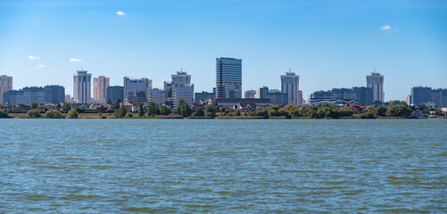 Obraz premium Modern Residential District Lebyazhy in Minsk Belarus by the Water with copy space