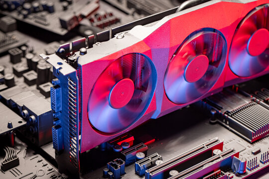 Closeup of motherboards with large cooling radiator and fans.
