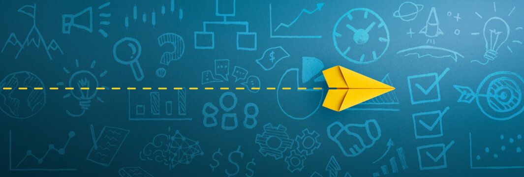 Business success, innovation and solution concept with Yellow paper plane and business strategy on blue background