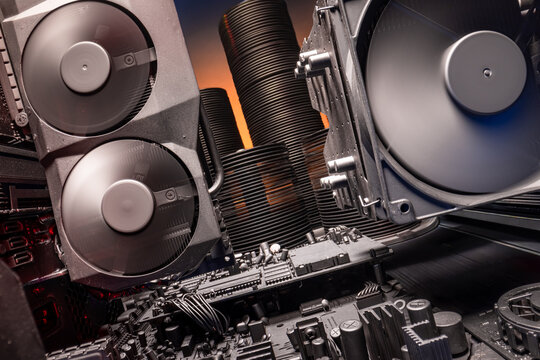 Closeup of motherboards with CPU and GPU and heatsink.