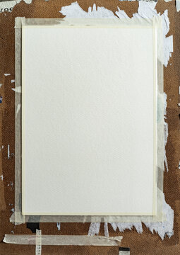 Blank Watercolor Paper Taped to Weathered Wooden Drawing Board with Masking Tape