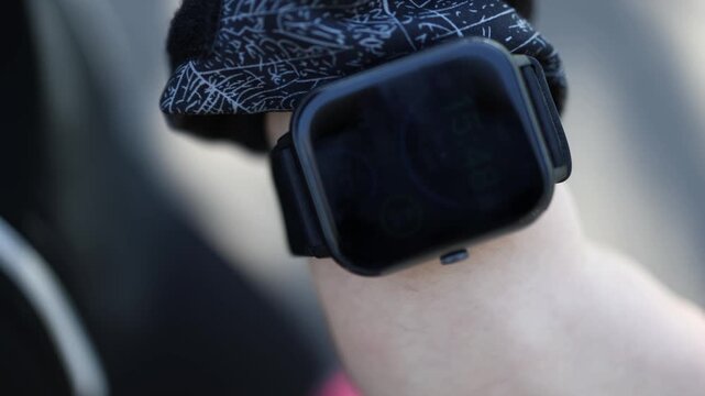Smartwatch screen on wrist shows time stats and activity data during workout tracking fitness progress heart rate calories steps modern wearable technology active lifestyle