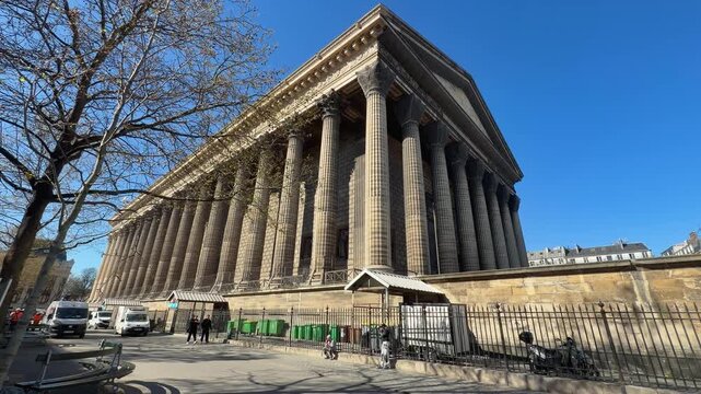 Bright city architecture. Historic church with busy surroundings