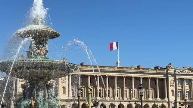 Classical monument featuring water jets under clear sky