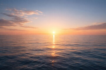 Obraz premium Gentle ocean horizon at sunrise with light clouds on a clear sky