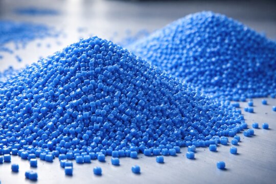 Close perspective on twin blue polypropylene granule mounds on table