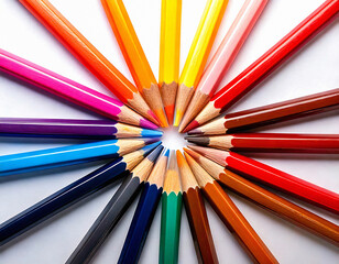 Naklejka premium Vibrant multicolored pencils arranged in a circle, symbolizing unity, creativity, and diversity. Ideal for education, art themes, and teamwork concepts in various marketing designs.