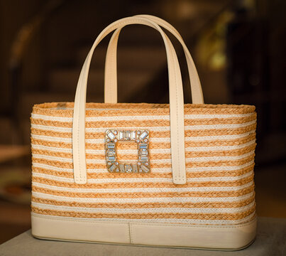 Summer raffia and leather shopper bag with a Roger Vivier jewelled buckle featuring crystals. Milan, Italy, 15 April 2026