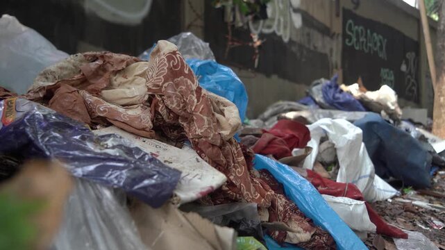 A Pile Of Garbage And Clothing On The Ground