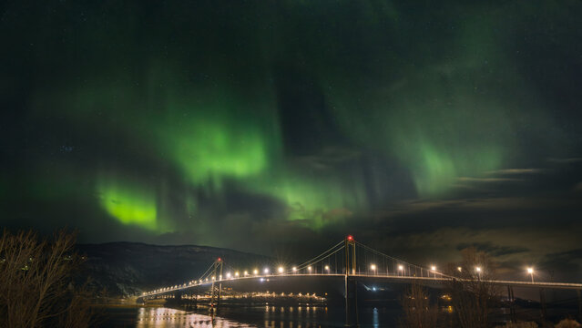 Majestic Northern Lights Dance Over Halogaland Bridge in Narvik, Norway