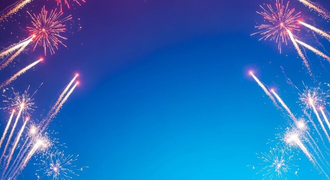 Vibrant fireworks exploding in the night sky with a gradient blue background festive celebration scene