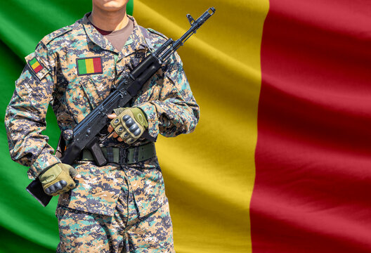 Mali flag with soldier holding assault rifle