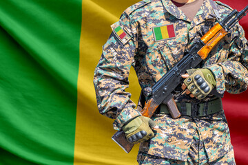 Obraz premium Mali flag with soldier holding assault rifle