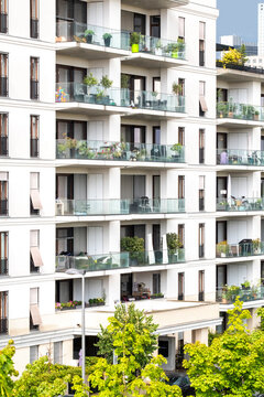 Modern apartments balconies facade in Frankfurt near Europagarten Germany with residential greenery and sustainable design shaping an urban living environment