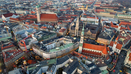 Obraz premium Aerial view around the old town of the Munich on a late December afternoon above the Christmas market on a cloudy day in Germany Bavaria.