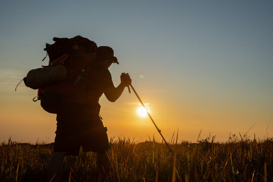 Hiking adventure at sunset nature landscape outdoor activity vibrant environment side view exploration journey