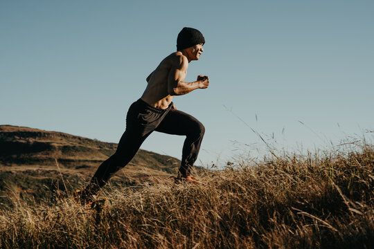 Runner overcoming challenges mountain landscape sports photography natural environment side view perseverance concept