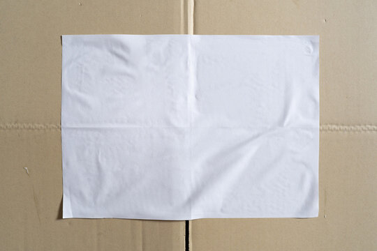 Blank White Paper Mockup Glued on Brown Corrugated Cardboard