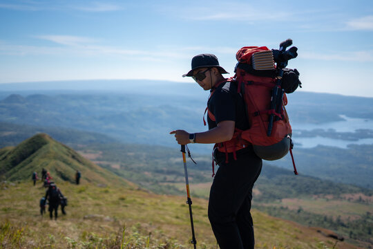 Hiking adventure mountain trail outdoor activity scenic view side perspective nature exploration