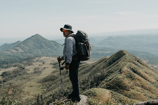 Hiking adventure on scenic hills nature reserve outdoor activity mountainous terrain wide-angle view exploration and adventure