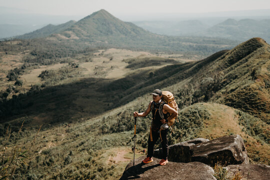 Adventure hiking enthusiast mountain range outdoor activity nature landscape elevated viewpoint exploration concept