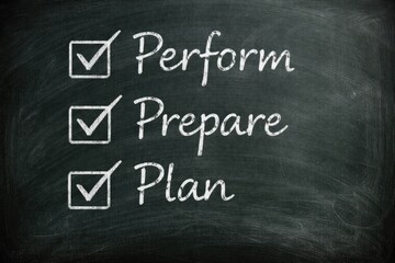Obraz premium Chalkboard showing perform prepare plan handwritten with check marks