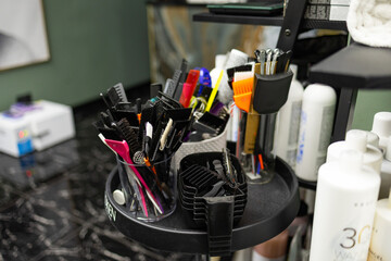 Fototapeta premium Professional hairdresser tools in a beauty salon, closeup
