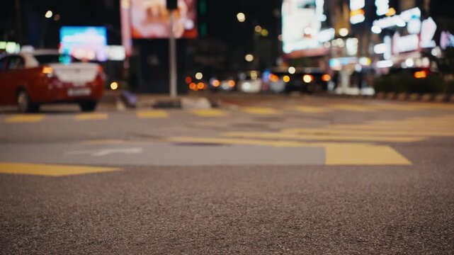 Urban traffic flowing on a busy city street at night