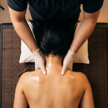 Back Massage Therapy Session In Professional Spa Setting