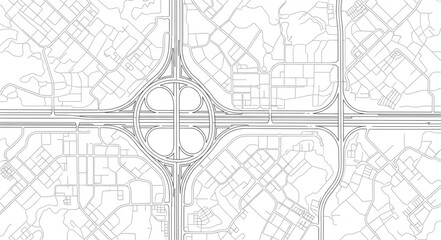 Aerial view of a complex highway interchange and surrounding city grid. © Yuki