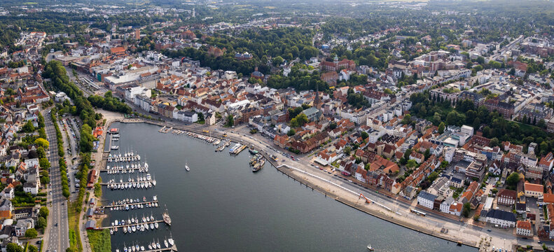 Aerial view around the old town of the city Flensburg in Germany on a sunny spring noon