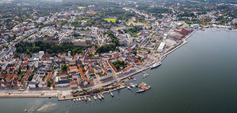 Aerial view around the old town of the city Flensburg in Germany on a sunny spring noon