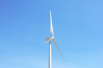 Fototapeta premium Single Wind Turbine Against Blue Sky