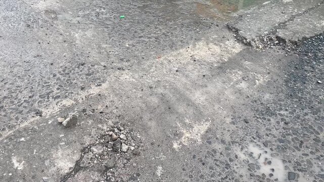 Broken Concrete Speed ​​Bump on Concrete Road
